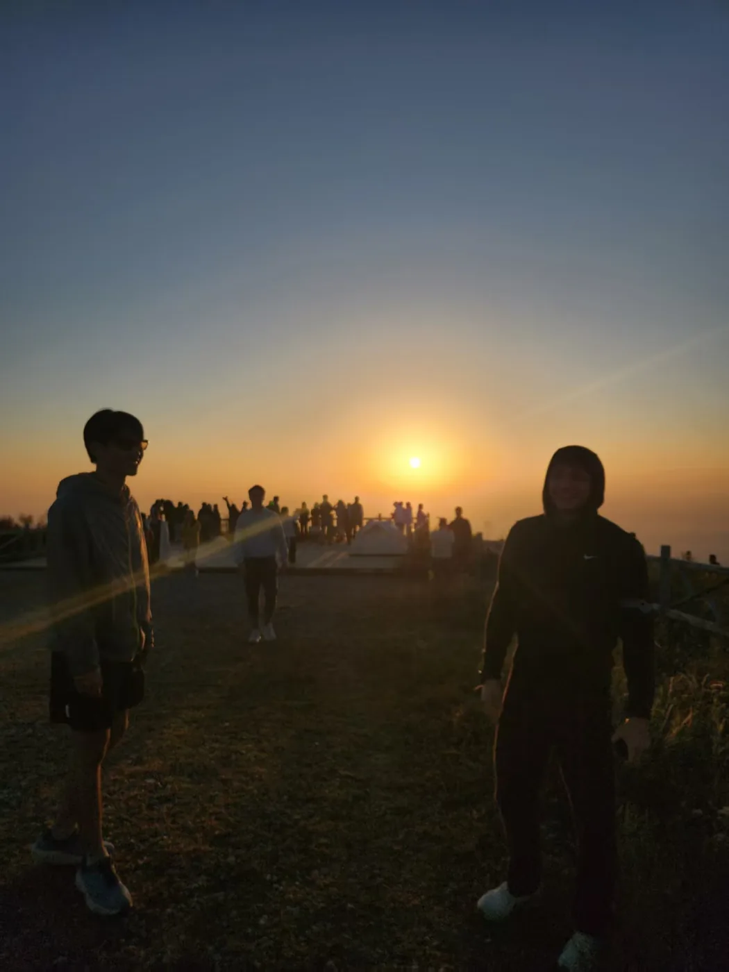 Sunset from the summit of Beijing 3 peaks hike, silhouettes against golden sky