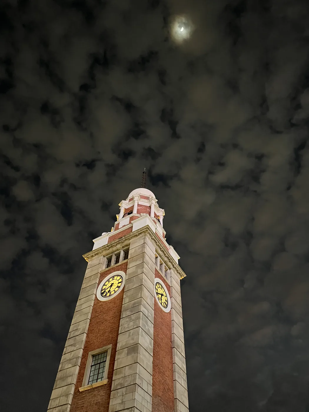 Tsim Sha Tsui Clock Tower at night with moon, Hong Kong