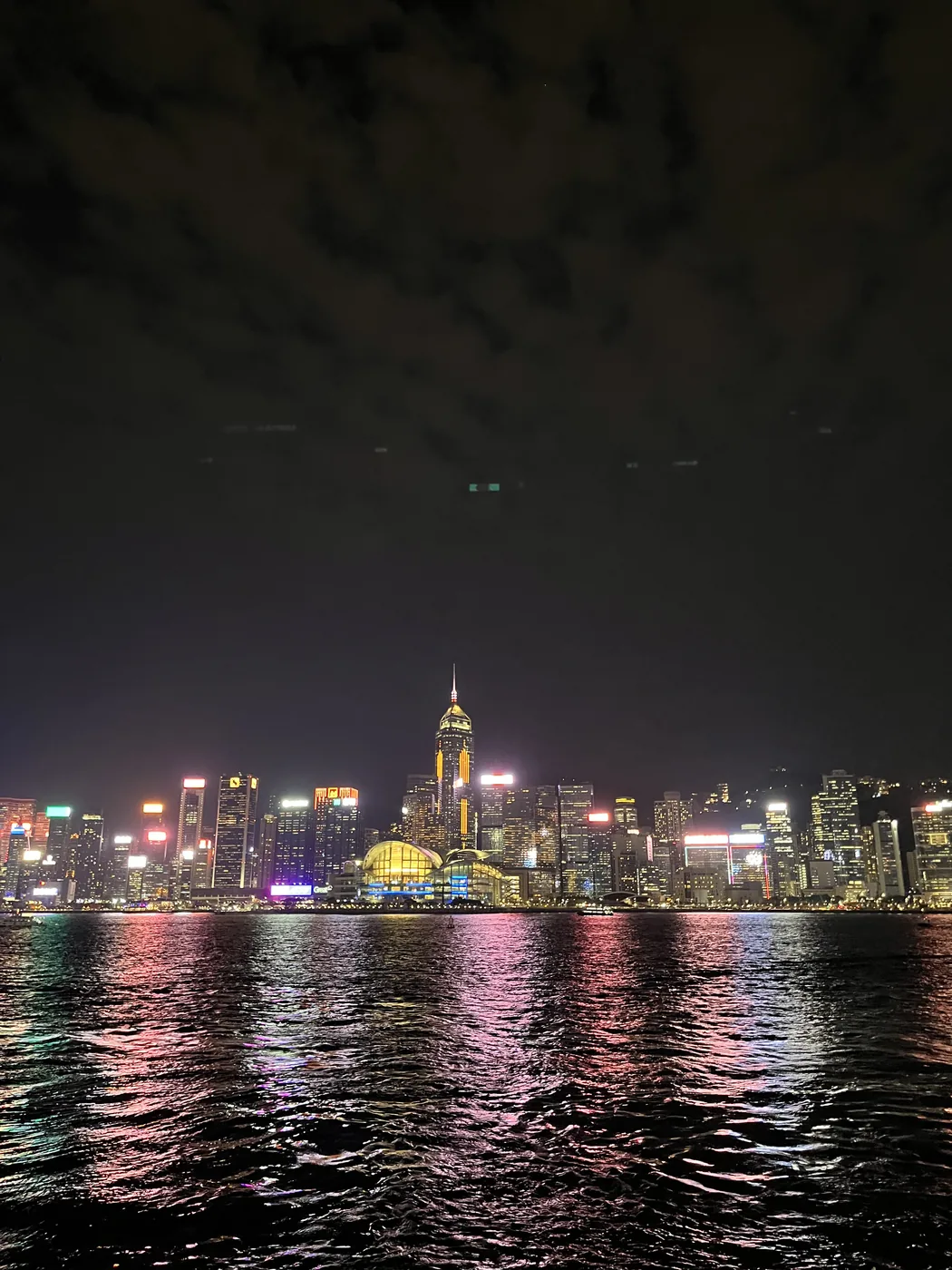 Hong Kong night skyline reflected in Victoria Harbour from Kowloon