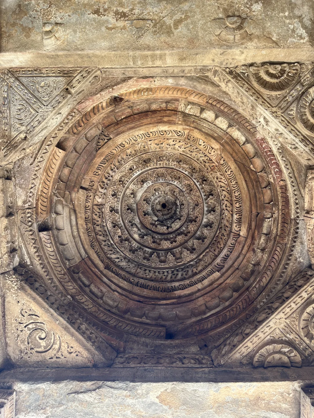 Intricate ceiling rosette carving at Qutb Minar complex