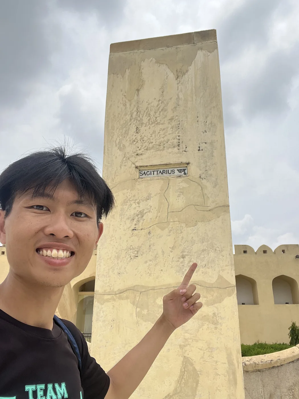 Pointing at the Sagittarius zodiac instrument at Jantar Mantar, Jaipur