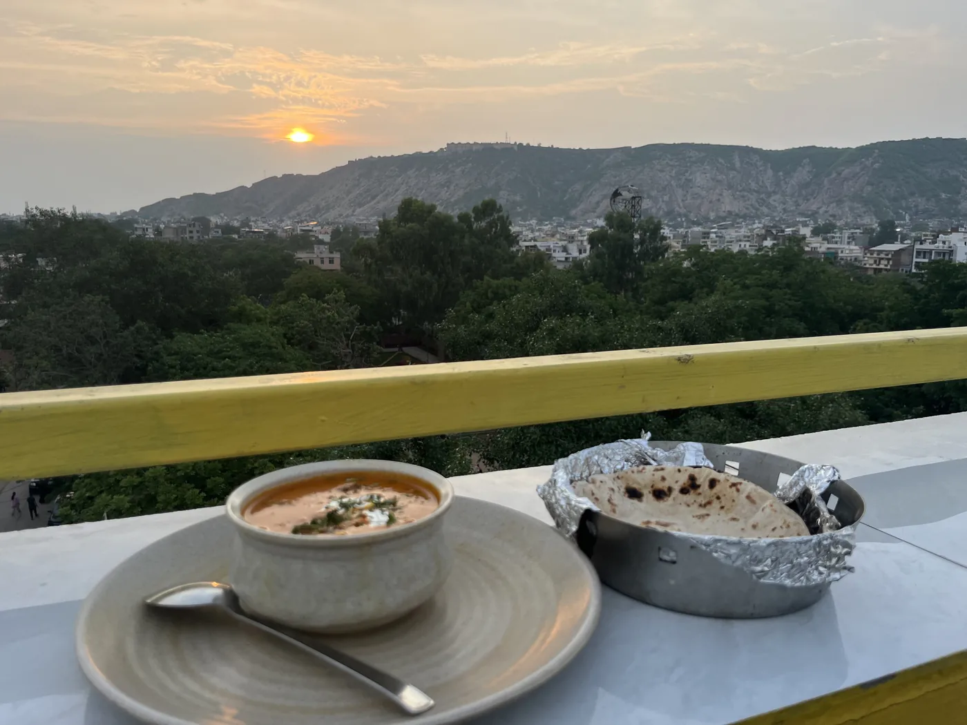 Rooftop dinner at sunset over Jaipur, dal makhani and roti