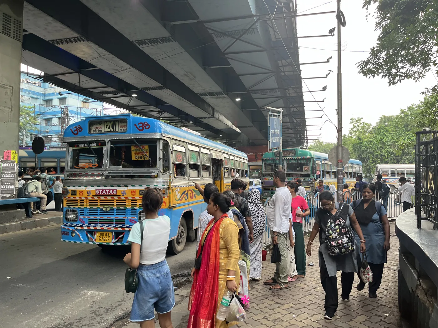 Hand-painted local buses at a Kolkata street