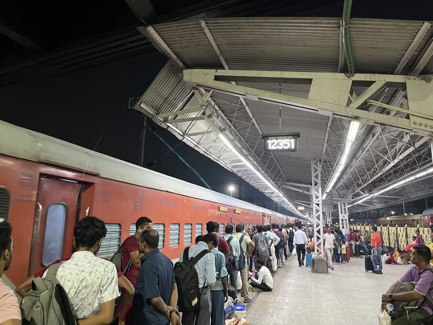 Busy train platform at Howrah Station, Kolkata, at night