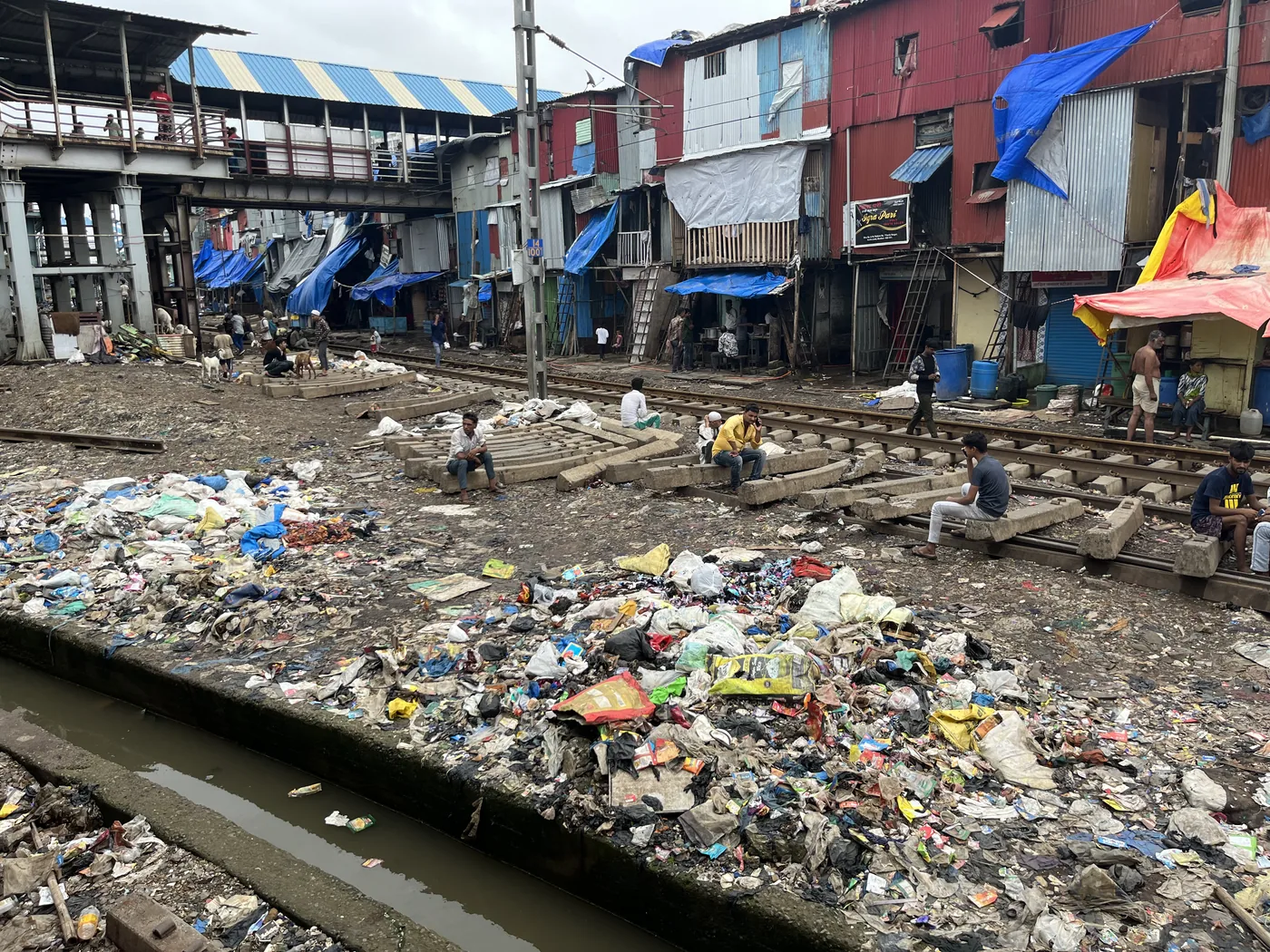 Railway tracks alongside Mumbai slum, raw reality