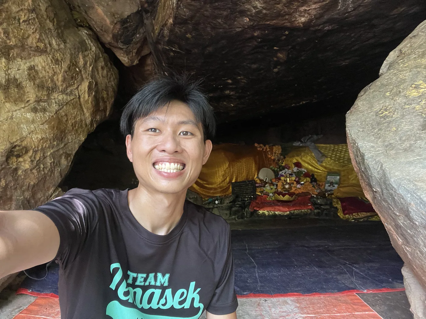 Selfie at a cave shrine with reclining Buddha, Rajgir