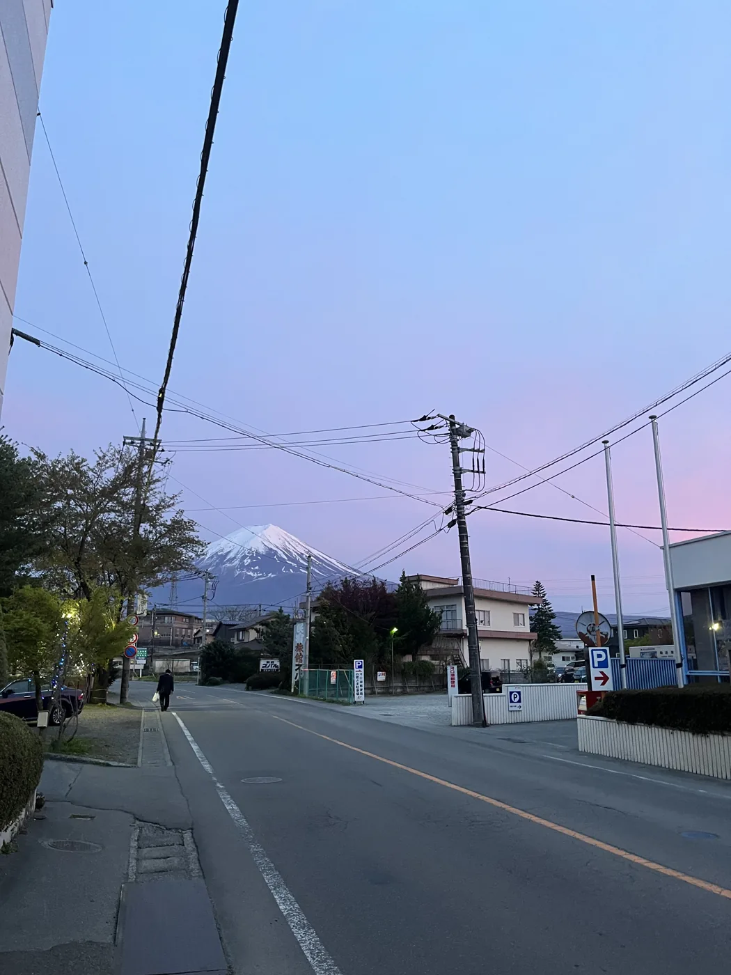 Mt Fuji at dusk from a quiet street in Kawaguchiko town