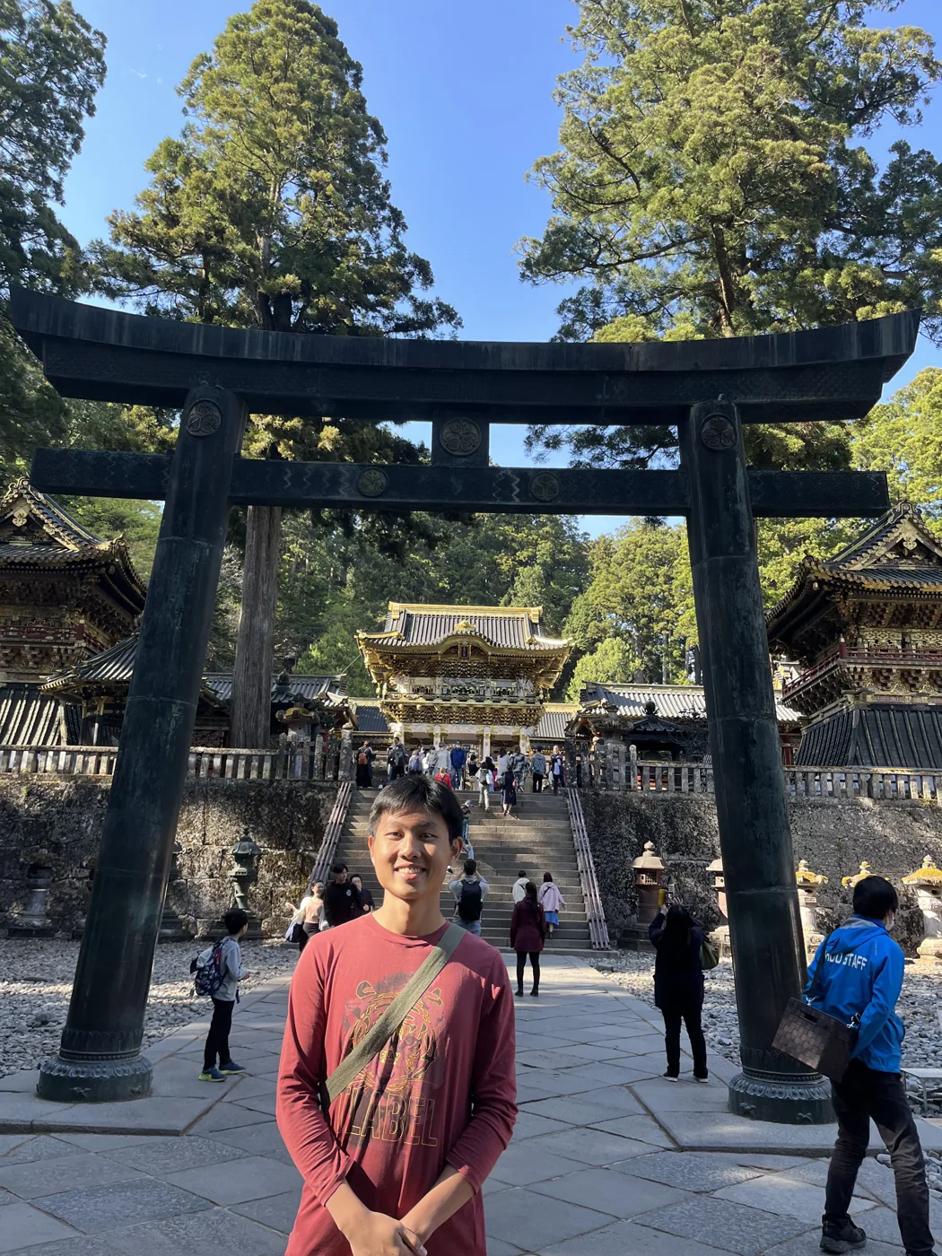 Standing under Tosho-gu Shrine torii gate, Nikko