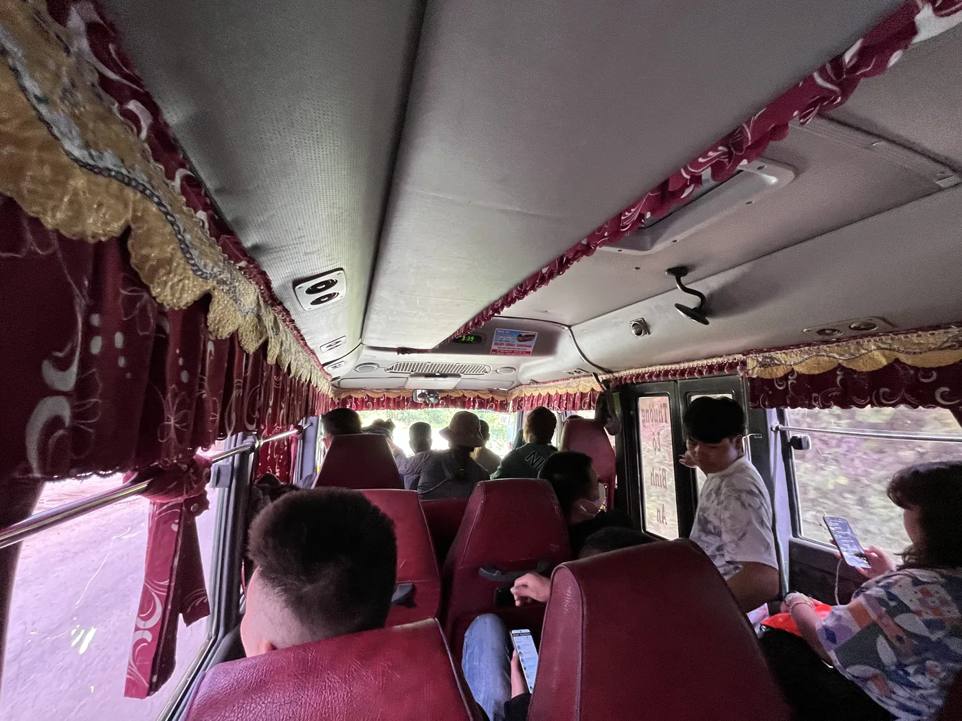 Inside local minivan on the road to Vietnam, Laos