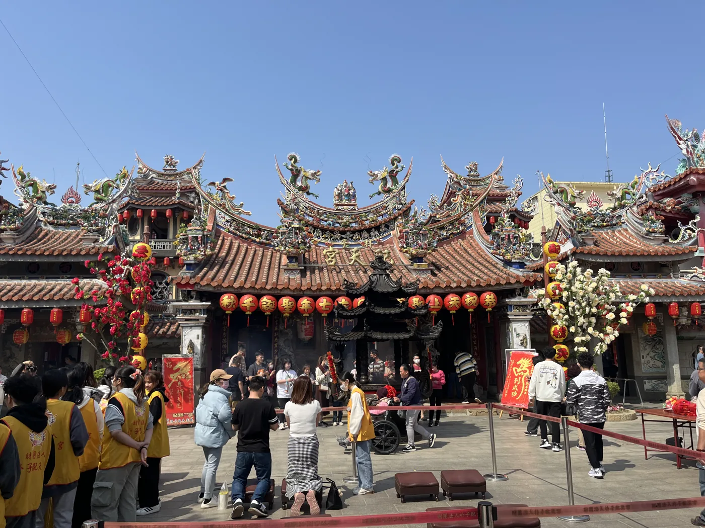 Busy temple courtyard with worshippers and lanterns, Taiwan