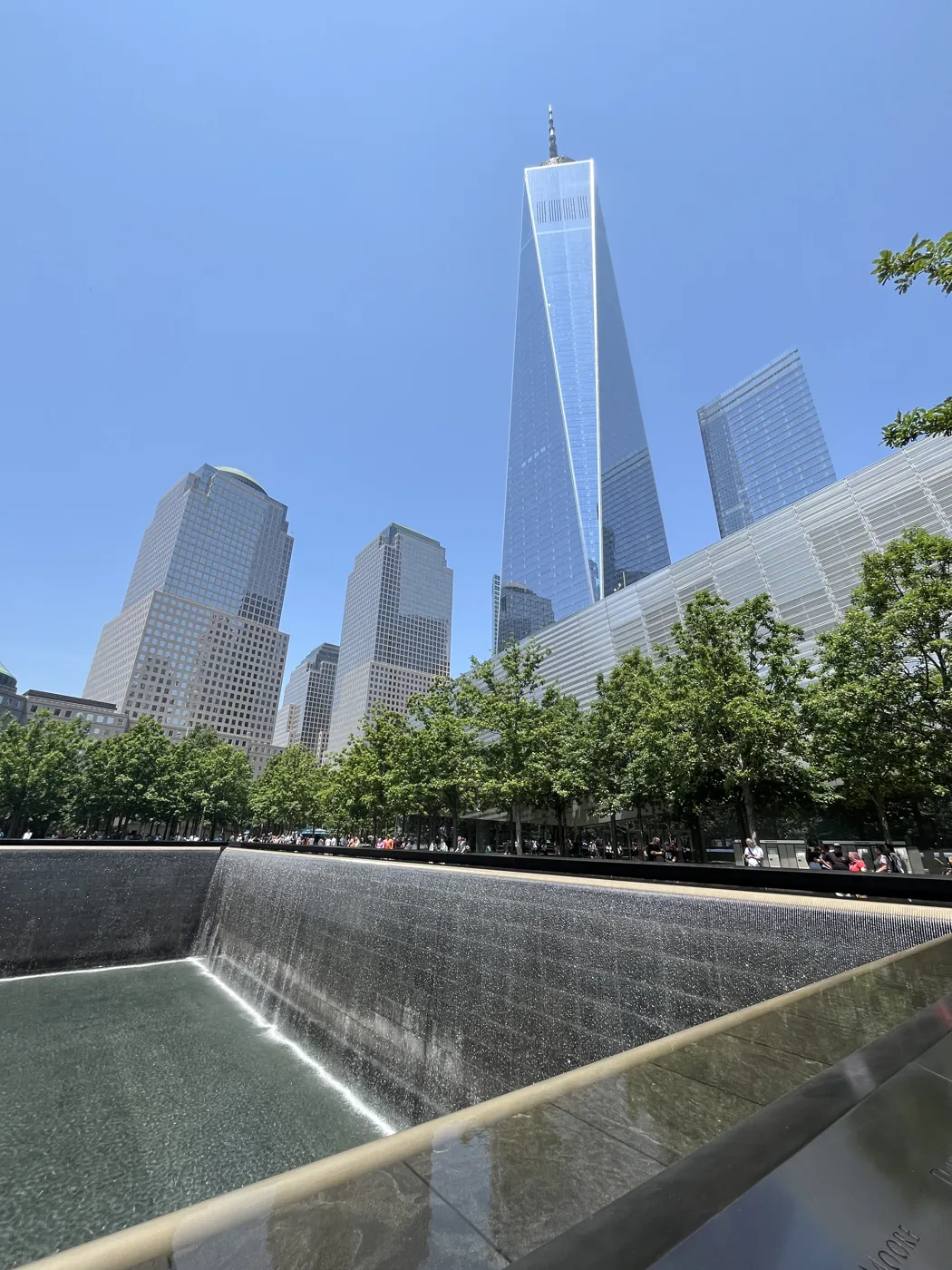 9/11 Memorial reflecting pool with One World Trade Center