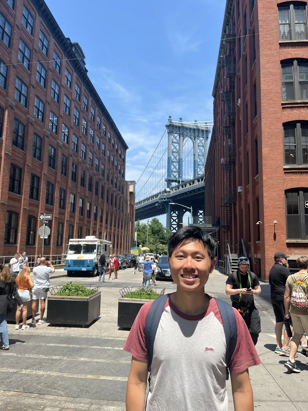 DUMBO Brooklyn with Manhattan Bridge framed between buildings