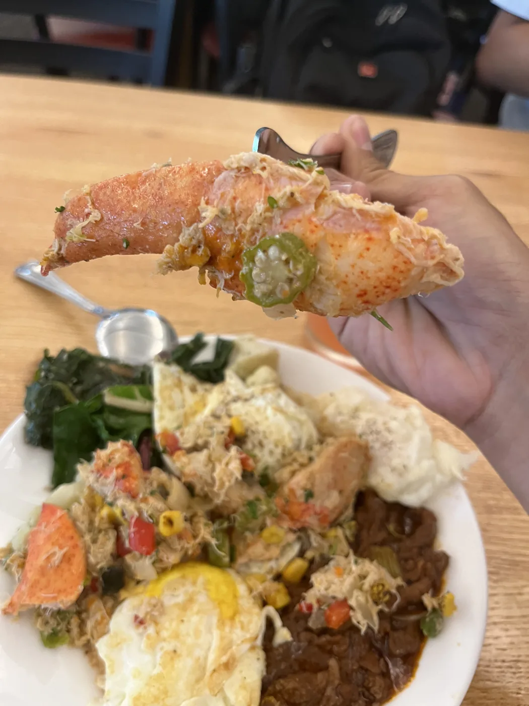 Holding up a Dungeness crab claw at Fisherman's Wharf SF
