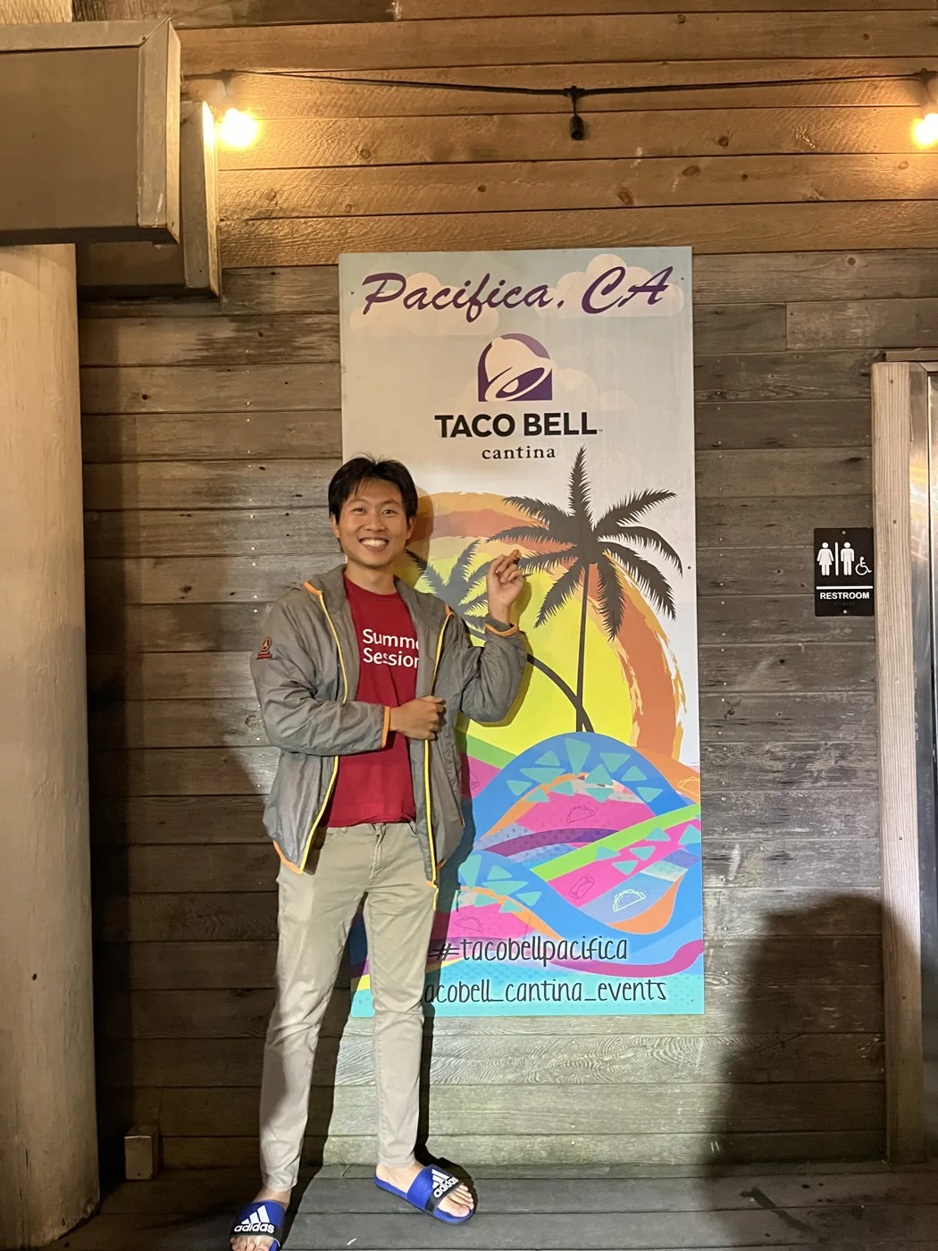 Standing at Pacifica CA Taco Bell Cantina sign