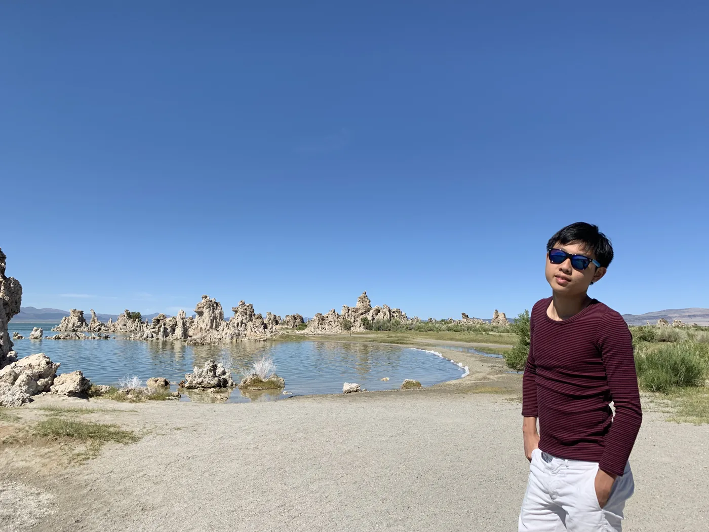 Standing at the shore of Mono Lake with tufa towers in the background