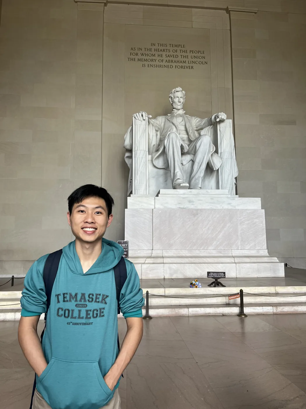 Standing in front of Lincoln Memorial statue, Washington D.C.